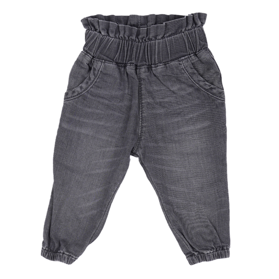 This picture shows a baby denim jeans in washed black. Made from gots organic cotton. 