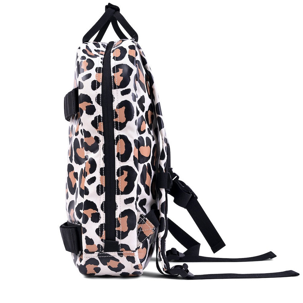This picture shows a kids backpack in a leopard print. Made from recycled plastic. Adjustable padded straps. Front pocket with zip. Straps on the front for your skateboard.
