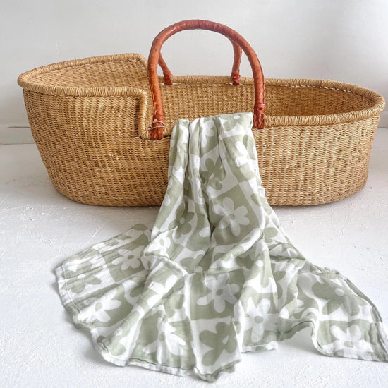 This picture shows the Bamboo/cotton Swaddle wrap with a sage flower print.