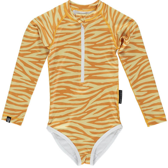 This picture shows a UPF50 Longsleeve swimsuit for girls in a beautiful golden tiger stripe print.