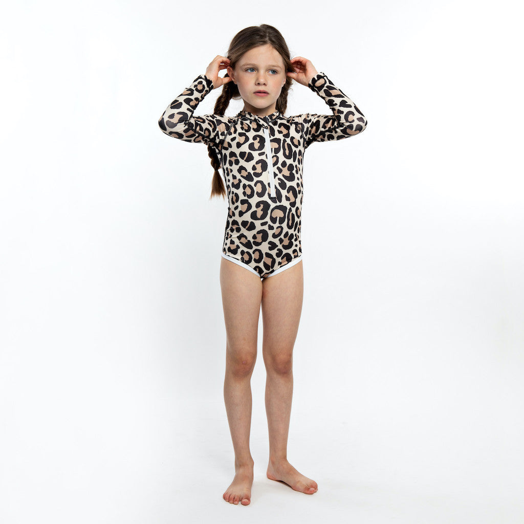 This picture shows a UPF50 Longsleeve swimsuit for girls in a beautiful leopard print