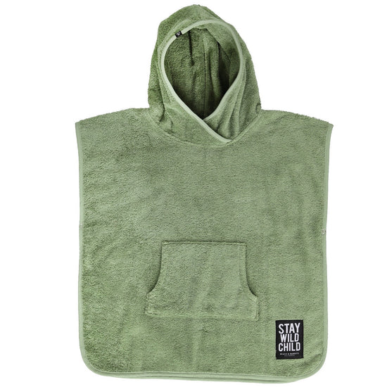 This picture shows a beach poncho made out of 100% organic cotton in the colour basil