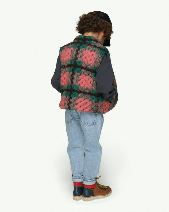 Load image into Gallery viewer,  This picture shows boy wearing a wool mix body warmer with snap button closure and soft organic lining. Pairs perfect with the breezy bull shorts! Available up to 10 Years.
