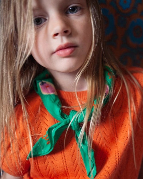 This picture shows a girl wearing the green seastar shelley scar from Maed for mini. 