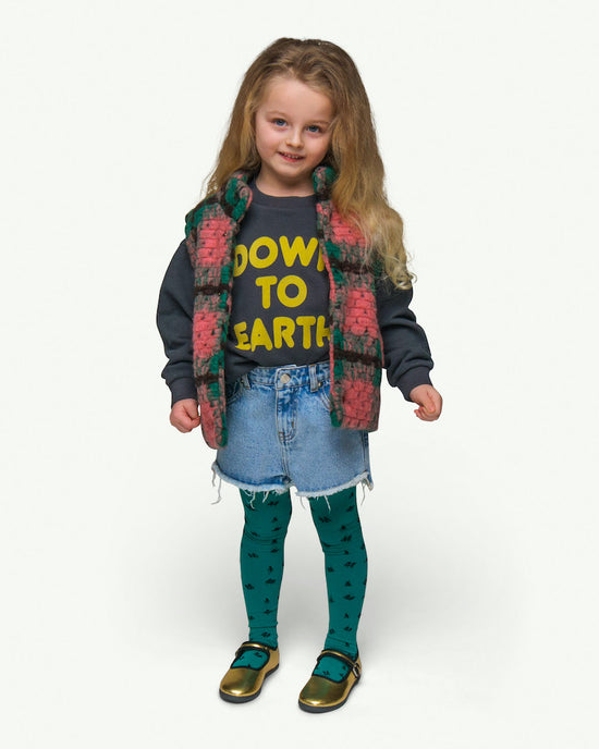  This picture shows a girl wearing a wool mix body warmer with snap button closure and soft organic lining. Pairs perfect with the breezy bull shorts! Available up to 10 Years.
