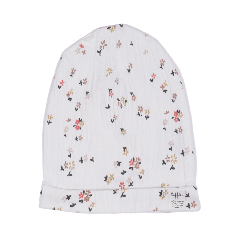 This picture show a newborn baby beanie with  beautiful blossom print. 