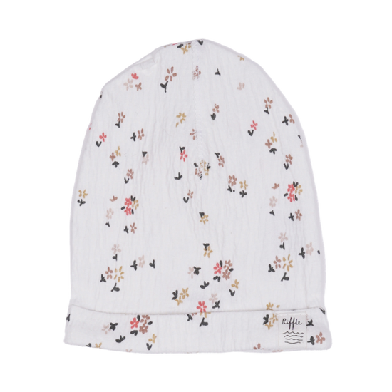 This picture show a newborn baby beanie with  beautiful blossom print. 