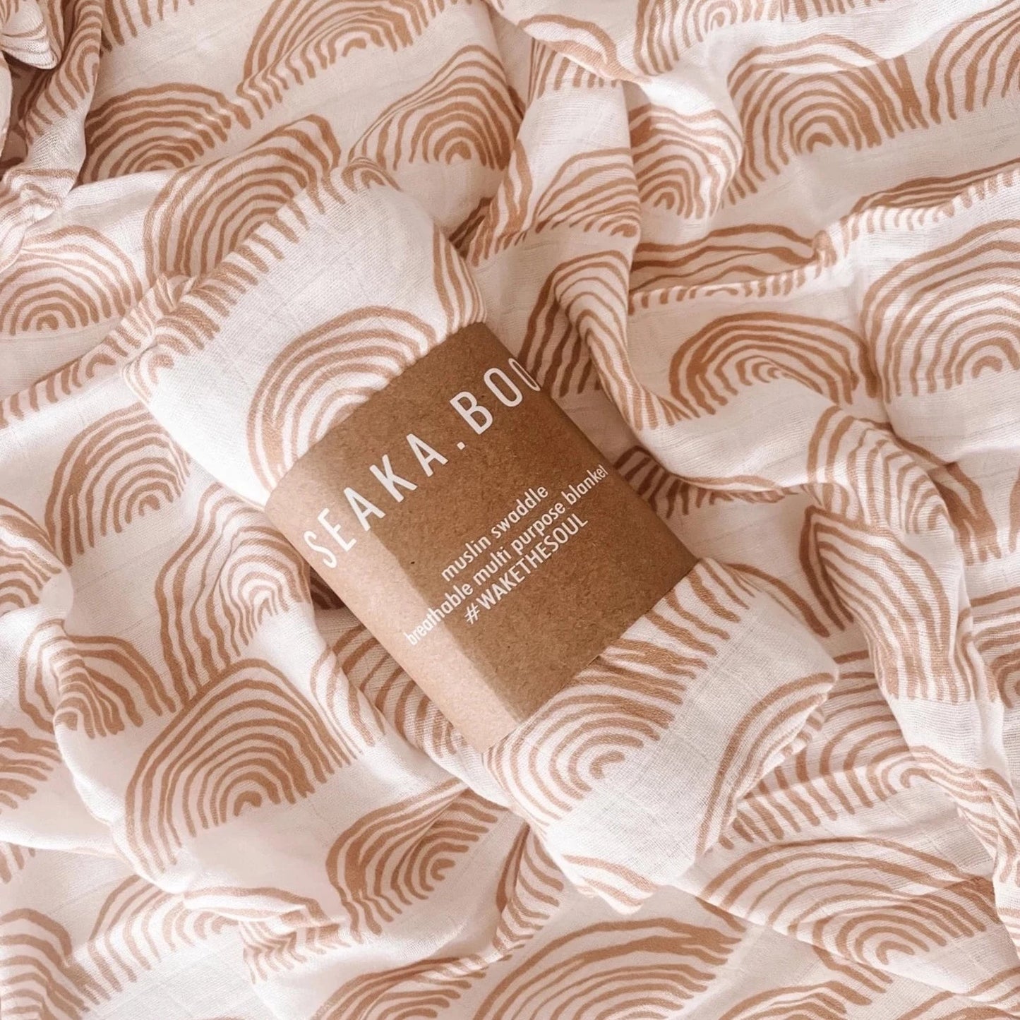 This picture shows the Bamboo / cotton Swaddle wrap with a nude rainbow print