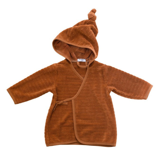 This picture shows a baby bath robe in toffee. Made from 100% Gots organic cotton in the most comfortable, stretchy and absorbent towel.