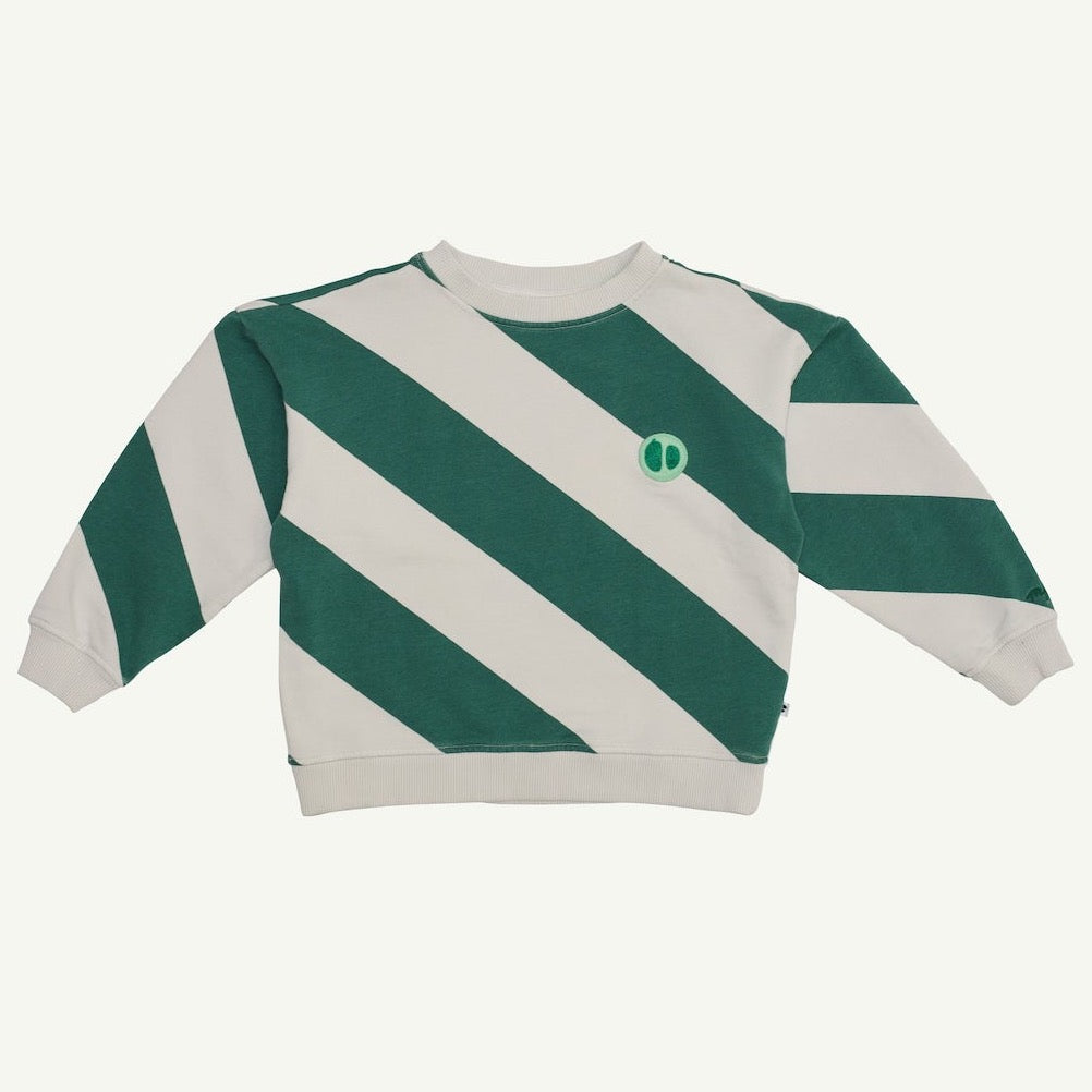 This pictures shows a comfy crewneck kids sweater with green big diagonal stripes and a small embroidered logo on the chest. 